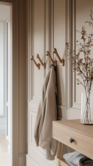 Scandinavian beige hallway with sleek wooden hooks.