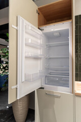 Fototapeta premium Built in cooler refrigerator in kitchen with open doors