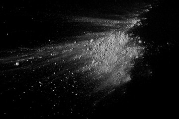 Powder white sugar scattered, isolated on black, top view and clipping