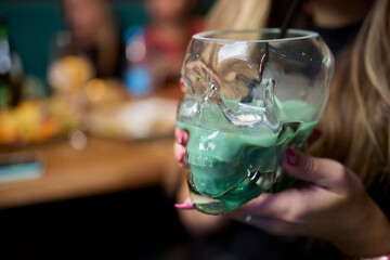 Enjoy a Colorful Cocktail Presented in a Unique and Eye Catching Skull Glass Style