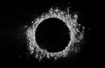 Powder white sugar in shape circle, isolated on black, top view and clipping