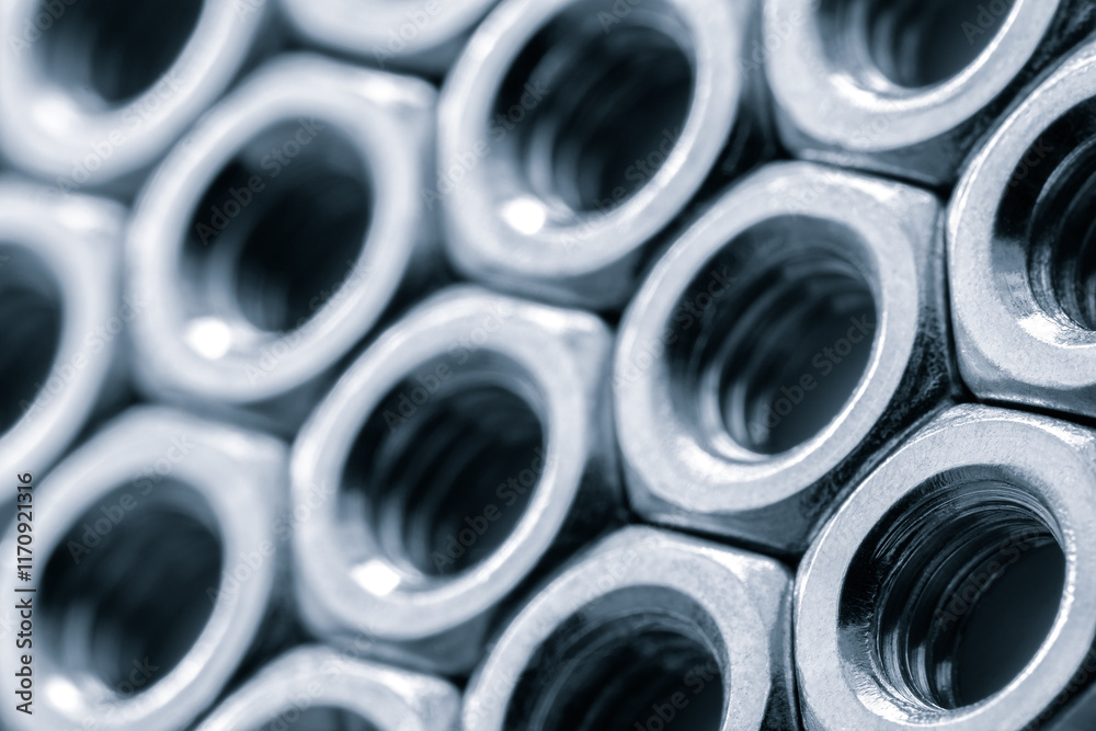 Poster metal nuts in a row background. chromed screw nuts. steel nuts pattern. tools for work.