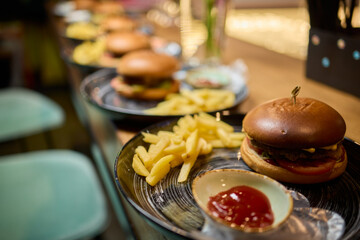 A Delicious Burger Accompanied by Crispy Fries Beautifully Served on a Stylish Plate