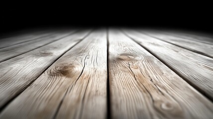 A wooden floor with a black background