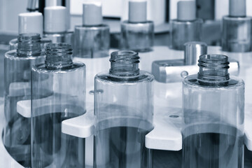 pharmaceutical industry, medicine pills are filling in the  bottle on production line machine conveyor at the medical factory. selective focus.