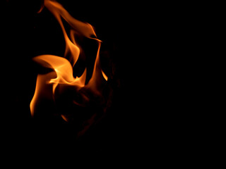 Fototapeta premium Open fire on a black background. Beautiful flame.