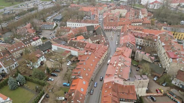 Vilnius, Lithuania - 30th november, 2024: aerial tilt up view Vilnius old town and Bohemian Uzupis area buildings. Center of self-proclaimed Republic of Uzupis. Vilnius landmarks sightseeing old town