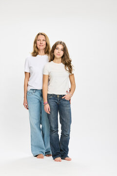Studio portrait of father with teenager.