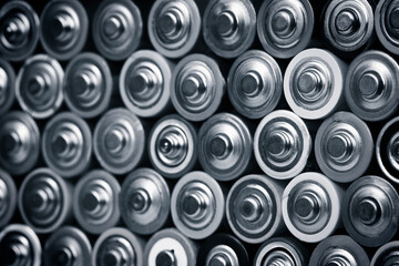 Closeup of pile of used alkaline batteries. Close up rows of selection of AA batteries energy...