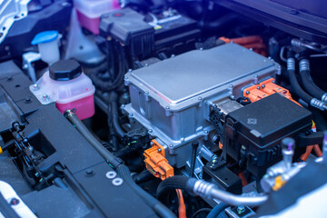 EV engine car engine block under hood electric vehicle high power and environmentally friendly zero emission. Chassis of the electric car with powertrain and power connection.