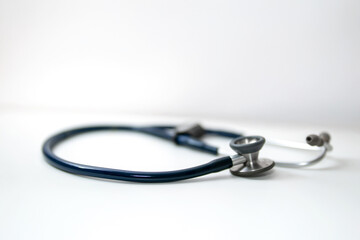 Close-Up of a Blue Stethoscope on a White Background, Symbolizing Healthcare and Medical Practice