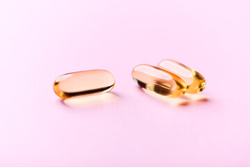 Fish oil capsules with omega 3 on bright background. Concept for a healthy dietary supplementation....