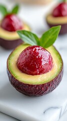 A close up of an avocado with a strawberry on top