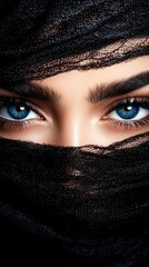 Fototapeta premium A woman with blue eyes peeking out from behind a black veil