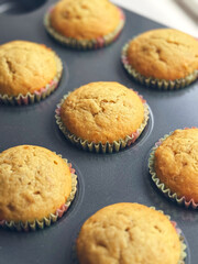 Banana muffins in a metal baking tray