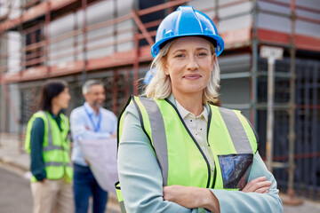 Proud mid adult woman engineer at construction site