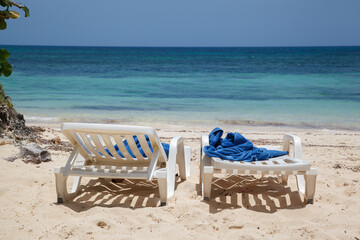 Beach chairs and the aribbean sea pristine waters in Guardalavaca sand beach, Club Amigo Atlantico...