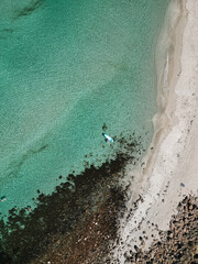 Drone view of a Paddleboarder on Turquoise Waters in Western Australia