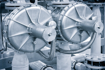 The gas pipeline is yellow with additional equipment, pipes and a valve to shut off the gas supply. Against the background of blur is an image of gas compressor station