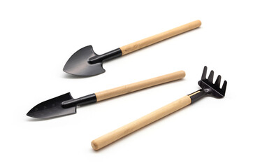 Digging Shovel Rake Spade Metal 3 pcs mini portable gardening tool set have wooden handle for succulent planter pots bonsai planting air plants indoor plants isolated on white background.