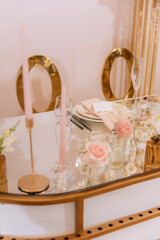 Decorating a hall for an expensive luxury wedding in a restaurant with lights, flowers, and seating details for guests