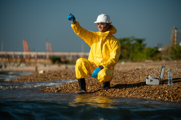 Scientist analysis professional wearing glasses and safety glove under working analysis water...