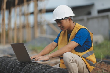 worker or engineer holding laptop computer and checking inside containers warehouse storage