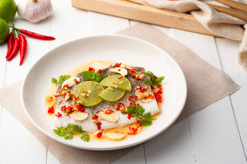 Steamed Seabass with Spicy Chili and Lemon Sauce.