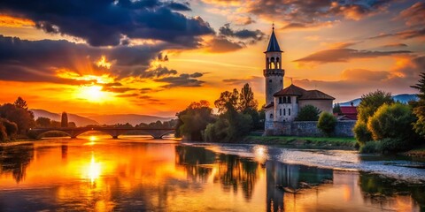 Naklejka premium Silhouette of Captain's Tower & Saint Anthony Church, Bihac, Bosnia and Herzegovina at Sunset