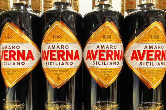 Viersen, Germany - December 9. 2024: Closeup of bottles Amaro Averna sicilian bitter liqueur in german store (focus on central labels)