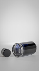 A bottle of perfume with a cap on top. The bottle is blue gradient glass premium photo 3d render