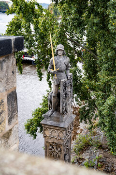 Stone statue of Bruncv&iacute;k, outdoor sculpture by sculptor Ludv&iacute;k &Scaron;imek on Charles Bridge, Prague, Czech Republic