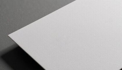 Close-up of a textured business card mockup, showing subtle embossing details, neutral lighting, no distractions
