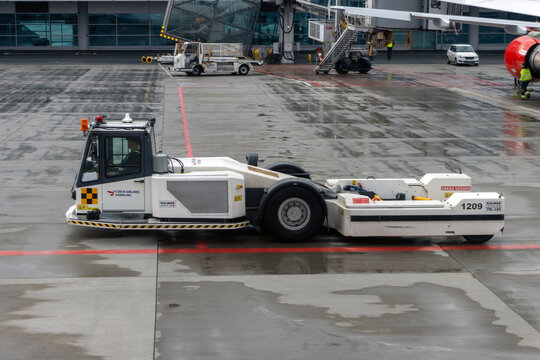 PRAGUE, CZECHIA, FEB 01 2024, The towbarless tractor (TBL) on a runway of an international airport