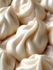 Close-up of creamy swirls, textured surface.