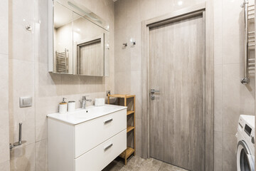 modern bathroom room with toilet and washing machine