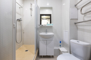 modern bathroom room with toilet and washing machine