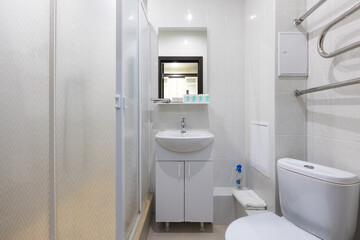 modern bathroom room with toilet and washing machine