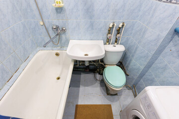 modern bathroom room with toilet and washing machine