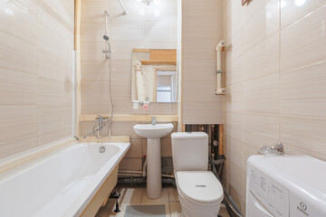 modern bathroom room with toilet and washing machine