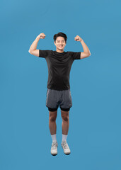 Generated ImageFull body image of Asian guy wearing workout clothes and posing on a blue background