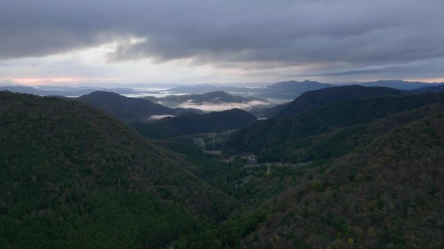 Aerial view of distant fog in mountain landscape of Fukuchiyama in Kyoto, Japan