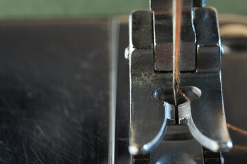 Sewing machine with thread, macro view. Space for text