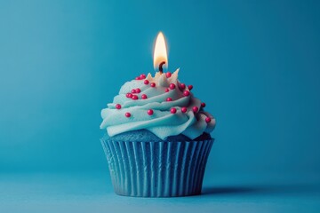 Celebration treat blue cupcake with red sprinkles indoor setting food photography playful concept