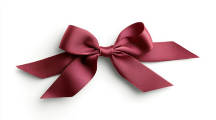 Fototapeta premium Stylish red satin ribbon bow with elegant loops and tails, perfect for gifts and decorations. This beautiful accessory adds touch of sophistication to any occasion