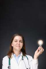 Doctor with glowing light bulb