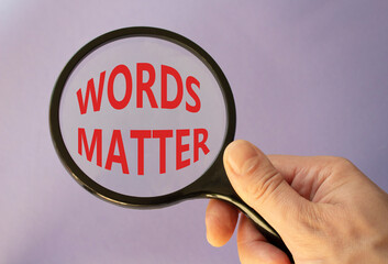 Words Matter symbol. Magnifying Glass with Concept word Words Matter. Businessman hand. Beautiful...