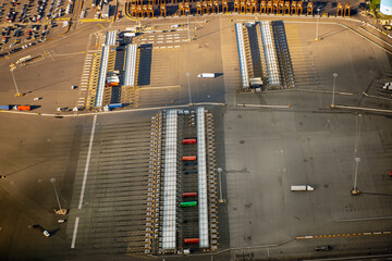 aerial of trucks in a port side marshalling yard