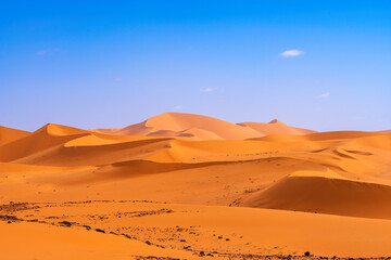 Tadrart Rouge, meaning Red Mountain, a mountain range in southeastern Algeria, part of the Algerian Desert providing massive dunes, rock formations and Martian landscapes