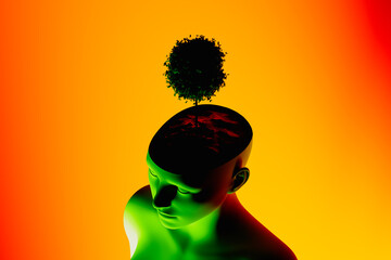 Human head silhouette with a tree symbolizing growth
